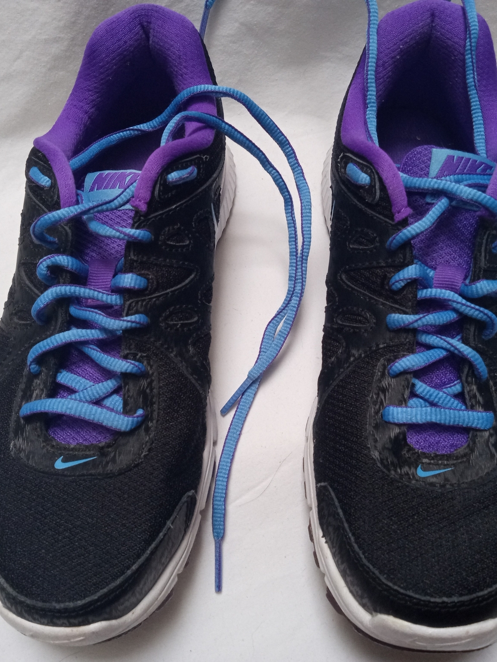 Nike Revolution 2 Women’s Black Shoes with Purple Interior and Blue Accents